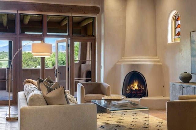 16 Plazuela Intimo, Santa Fe, NM 87506 - living area featuring healthy amount of natural light and a large fireplace