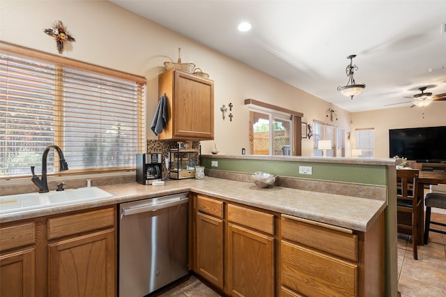 4737 Sundial Way, Santa Fe, NM 87507 - kitchen with dishwasher, a peninsula, a ceiling fan, open floor plan, and light countertops