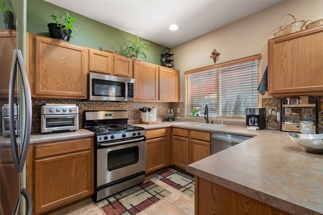 4737 Sundial Way, Santa Fe, NM 87507 - kitchen with stainless steel appliances, decorative backsplash, light countertops, and recessed lighting