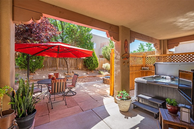 4737 Sundial Way, Santa Fe, NM 87507 - fenced backyard featuring a hot tub, a patio, and outdoor dining area