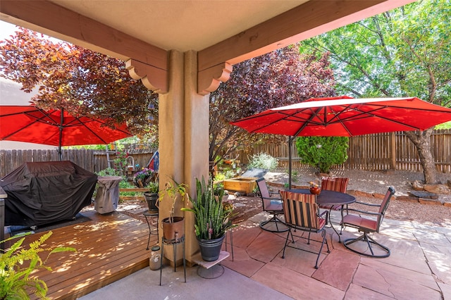 4737 Sundial Way, Santa Fe, NM 87507 - fenced backyard with a wooden deck, outdoor dining area, a patio area, and grilling area
