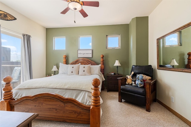 4737 Sundial Way, Santa Fe, NM 87507 - bedroom with multiple windows, light colored carpet, and a ceiling fan