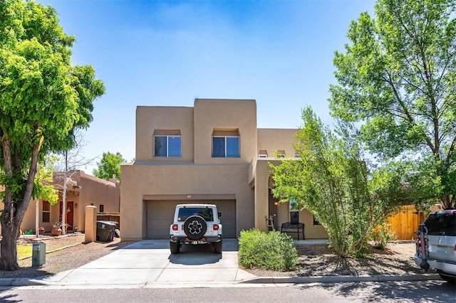 4737 Sundial Way, Santa Fe, NM 87507 - adobe home with concrete driveway, stucco siding, and an attached garage