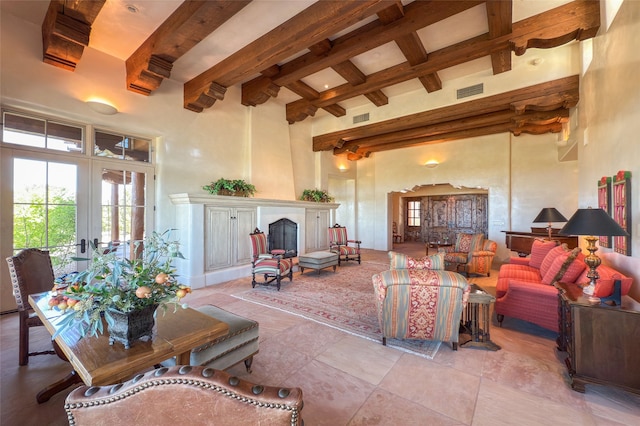 11 E Golden Eagle Rd, Santa Fe, NM 87506 - living room featuring beam ceiling, a high ceiling, plenty of natural light, french doors, and a large fireplace