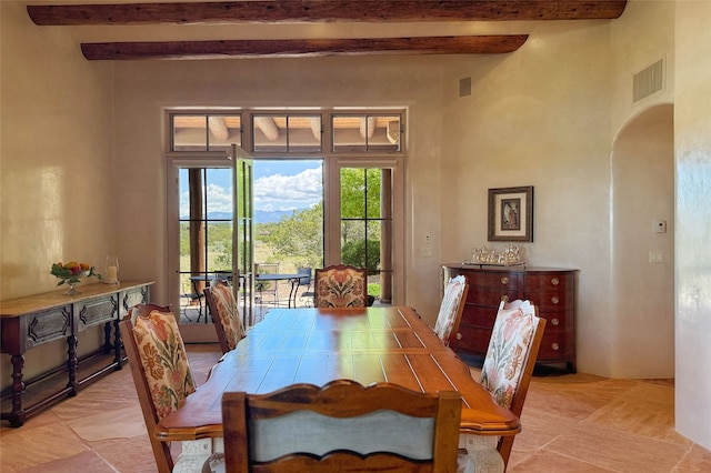 11 E Golden Eagle Rd, Santa Fe, NM 87506 - dining room with beam ceiling and arched walkways