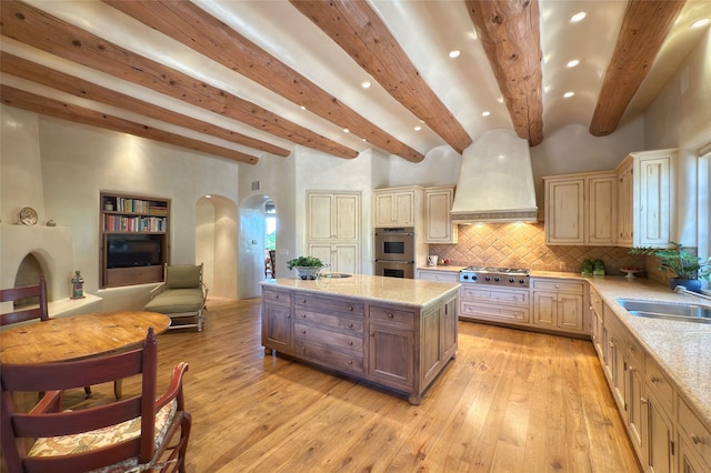 11 E Golden Eagle Rd, Santa Fe, NM 87506 - kitchen featuring premium range hood, arched walkways, beamed ceiling, stainless steel appliances, and recessed lighting