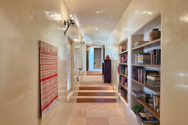 11 E Golden Eagle Rd, Santa Fe, NM 87506 - hall featuring tile patterned floors, built in shelves, and arched walkways