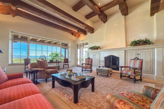 11 E Golden Eagle Rd, Santa Fe, NM 87506 - living room featuring beam ceiling, a high ceiling, and a premium fireplace
