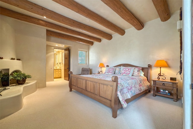 11 E Golden Eagle Rd, Santa Fe, NM 87506 - bedroom with beam ceiling, carpet floors, and ensuite bath