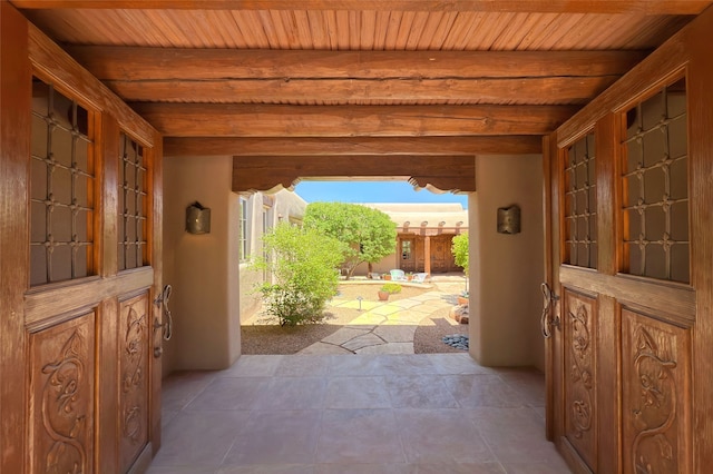 11 E Golden Eagle Rd, Santa Fe, NM 87506 - entryway featuring tile patterned floors and a wood ceiling with exposed beams