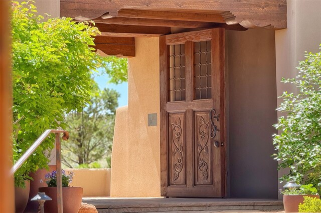 11 E Golden Eagle Rd, Santa Fe, NM 87506 - property entrance featuring stucco siding and a balcony