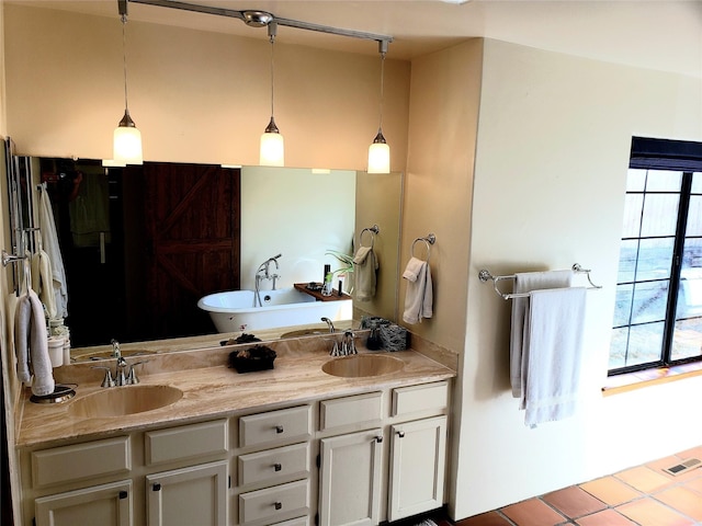 2730 La Silla Dorada, Santa Fe, NM 87505 - bathroom with tile patterned flooring, double vanity, and a soaking tub