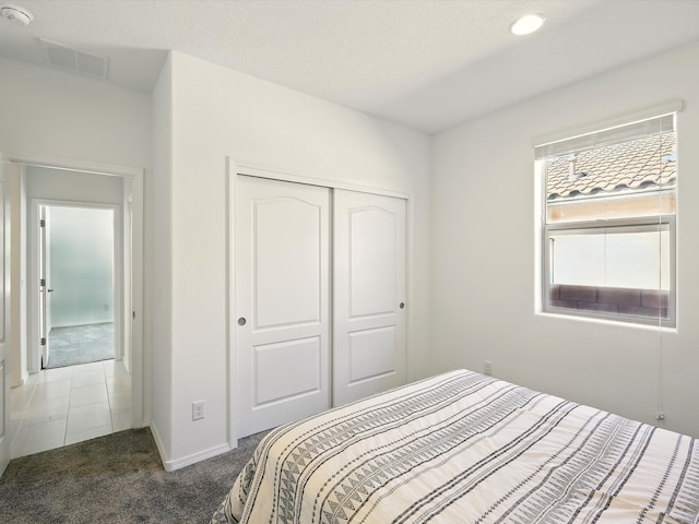 13 Firecrown Ln, Santa Fe, NM 87508 - carpeted bedroom featuring a closet and baseboards