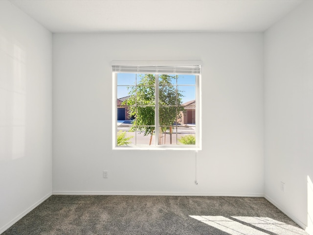 13 Firecrown Ln, Santa Fe, NM 87508 - empty room with dark colored carpet and baseboards