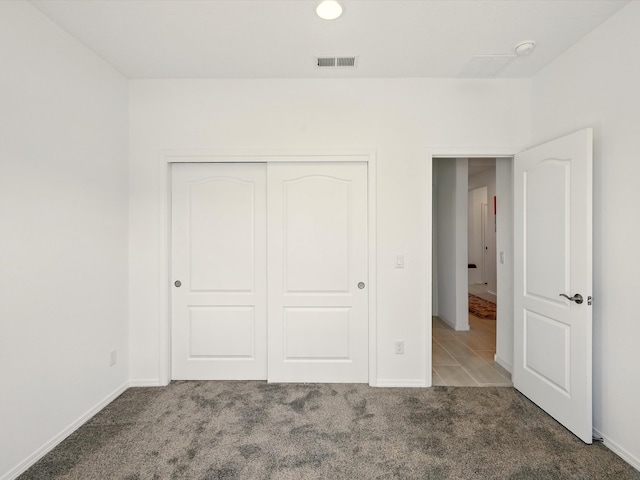 13 Firecrown Ln, Santa Fe, NM 87508 - unfurnished bedroom featuring carpet floors, a closet, and recessed lighting