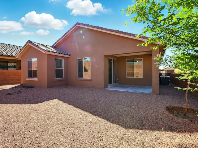 13 Firecrown Ln, Santa Fe, NM 87508 - rear view of property with stucco siding, a patio, and a tile roof