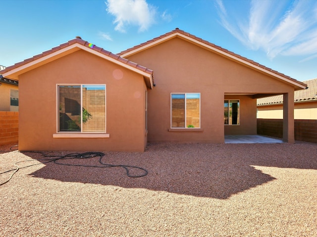 13 Firecrown Ln, Santa Fe, NM 87508 - rear view of house featuring a patio and stucco siding