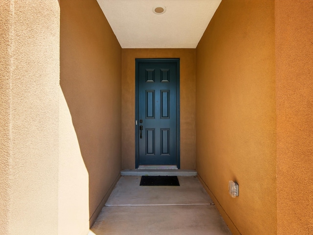13 Firecrown Ln, Santa Fe, NM 87508 - doorway to property featuring stucco siding