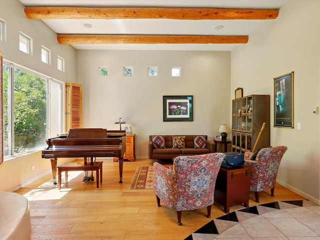 29 Brilliant Sky Dr, Santa Fe, NM 87508 - living room featuring light wood-type flooring, plenty of natural light, a high ceiling, and beam ceiling