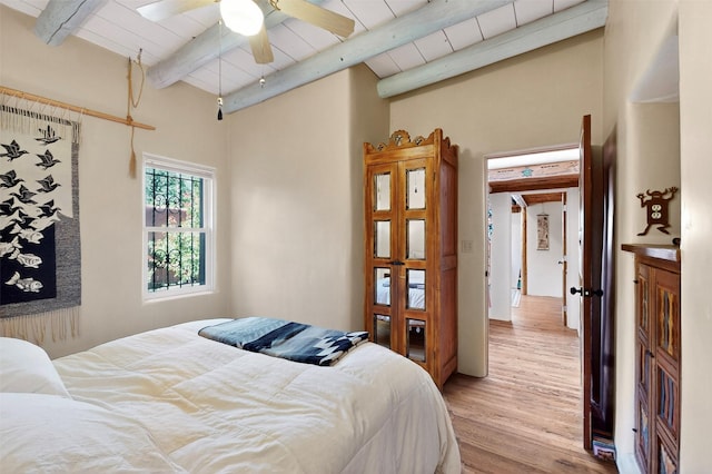 952 Acequia Madre, Santa Fe, NM 87505 - bedroom featuring beamed ceiling and light wood-type flooring