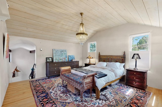 952 Acequia Madre, Santa Fe, NM 87505 - bedroom with wood finished floors, lofted ceiling, wood ceiling, and arched walkways