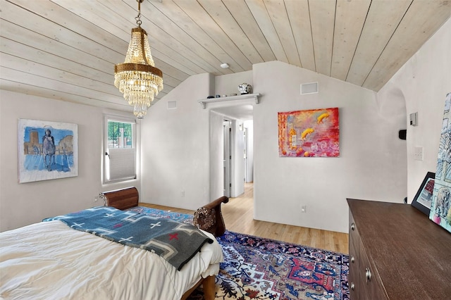 952 Acequia Madre, Santa Fe, NM 87505 - bedroom featuring lofted ceiling, wooden ceiling, a chandelier, and wood finished floors