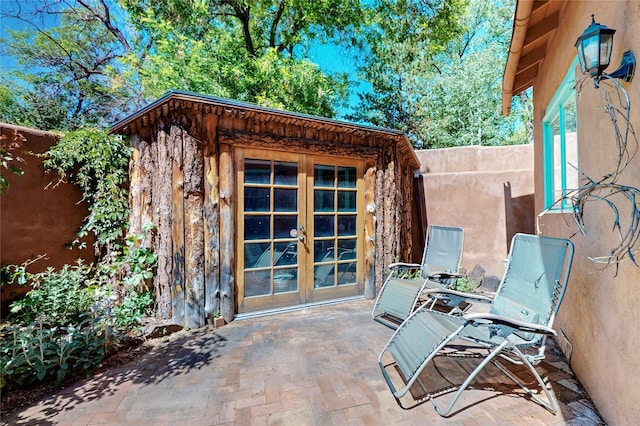 952 Acequia Madre, Santa Fe, NM 87505 - view of patio featuring french doors
