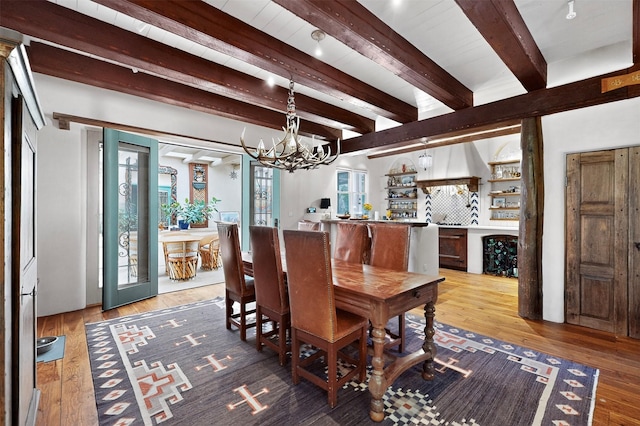 952 Acequia Madre, Santa Fe, NM 87505 - dining space featuring a chandelier, light wood-style flooring, and beam ceiling