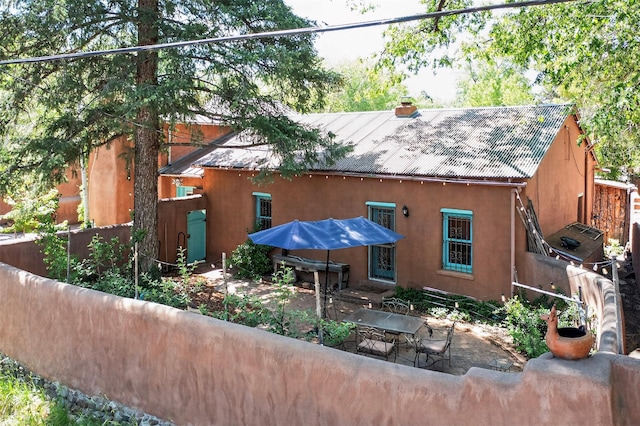 952 Acequia Madre, Santa Fe, NM 87505 - back of property with stucco siding and a patio area