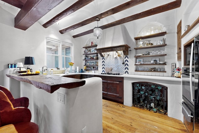952 Acequia Madre, Santa Fe, NM 87505 - bar area with a warming drawer, beamed ceiling, light wood-style floors, premium range hood, and black gas stovetop