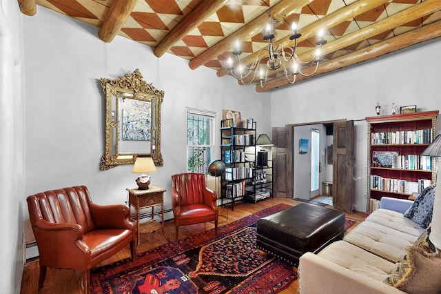 952 Acequia Madre, Santa Fe, NM 87505 - sitting room with wood-type flooring, a baseboard radiator, beamed ceiling, a chandelier, and a high ceiling