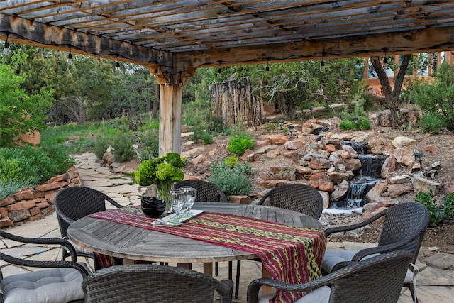 15 Cielo Cumbre Rd, Santa Fe, NM 87505 - view of patio featuring outdoor dining space and a pergola