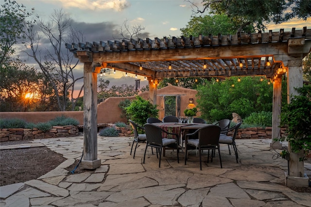 15 Cielo Cumbre Rd, Santa Fe, NM 87505 - patio terrace at dusk with a patio area, outdoor dining area, and a pergola