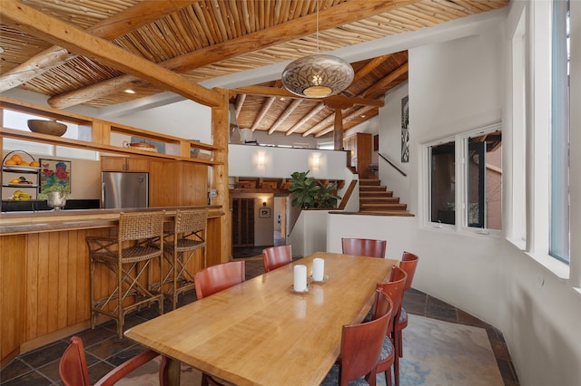15 Cielo Cumbre Rd, Santa Fe, NM 87505 - dining area with stone tile flooring, stairway, a wood ceiling with exposed beams, and bar area