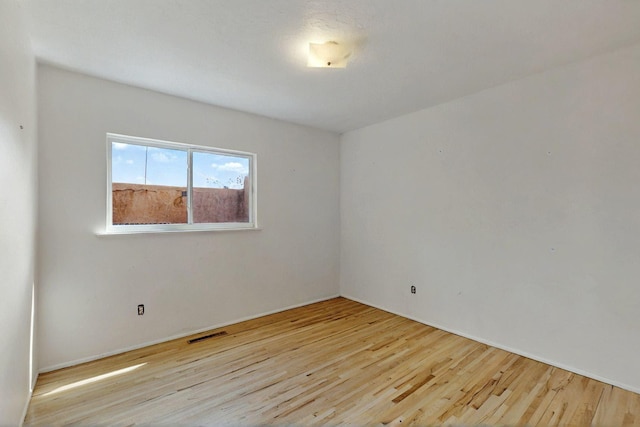 1017 Practilliano Dr, Santa Fe, NM 87505 - unfurnished room featuring wood finished floors