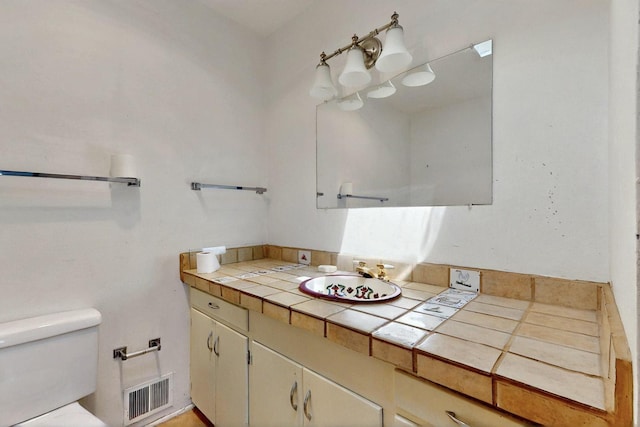 1017 Practilliano Dr, Santa Fe, NM 87505 - bathroom featuring toilet and vanity