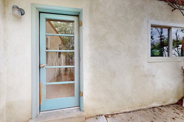 1017 Practilliano Dr, Santa Fe, NM 87505 - property entrance featuring stucco siding