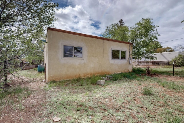 1017 Practilliano Dr, Santa Fe, NM 87505 - view of home's exterior with stucco siding