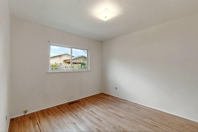 1017 Practilliano Dr, Santa Fe, NM 87505 - empty room with wood finished floors and baseboards