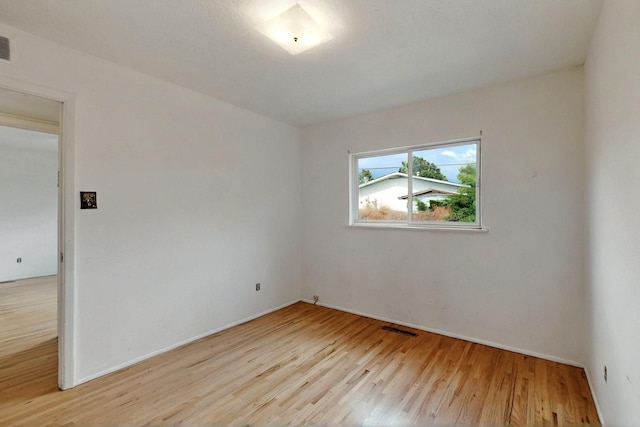 1017 Practilliano Dr, Santa Fe, NM 87505 - unfurnished room featuring light wood finished floors and baseboards