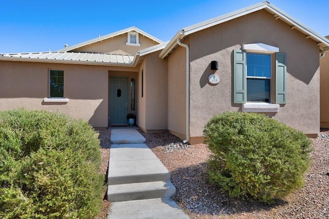 139 Rancho Viejo Blvd, Santa Fe, NM 87508 - view of exterior entry featuring stucco siding and a metal roof