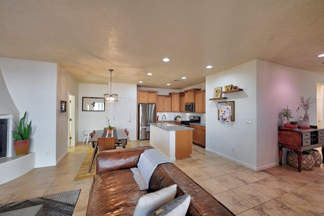 139 Rancho Viejo Blvd, Santa Fe, NM 87508 - living area featuring recessed lighting, light tile patterned flooring, and a textured ceiling