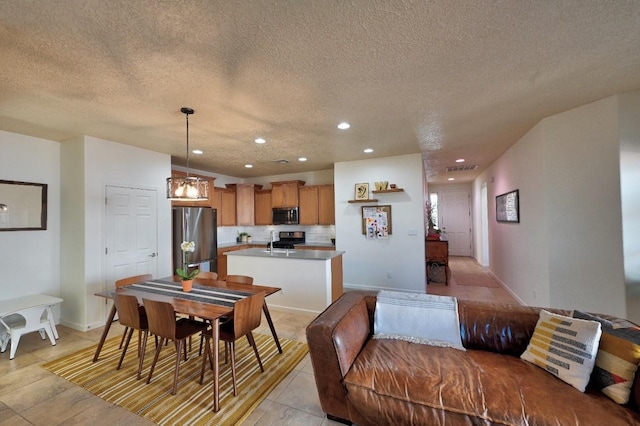 139 Rancho Viejo Blvd, Santa Fe, NM 87508 - dining area with a textured ceiling, recessed lighting, and light tile patterned floors