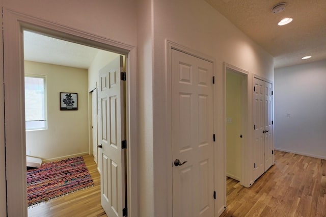 139 Rancho Viejo Blvd, Santa Fe, NM 87508 - corridor featuring light wood-style floors and recessed lighting