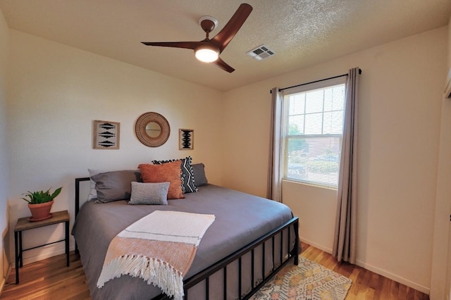 139 Rancho Viejo Blvd, Santa Fe, NM 87508 - bedroom with light wood-style floors and a ceiling fan