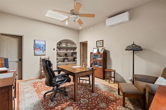 1203 Sierra Del Este, Santa Fe, NM 87501 - office area with an AC wall unit, ceiling fan, built in shelves, and wood finished floors