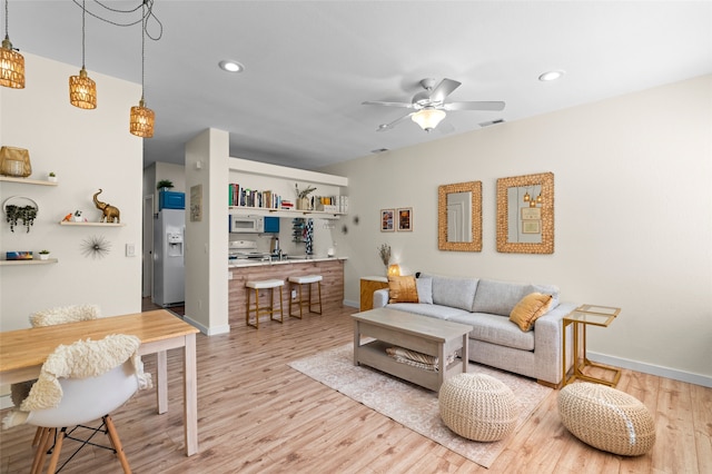 7206 Avenida El Nido, Santa Fe, NM 87507 - living area with wood finished floors, a ceiling fan, and recessed lighting