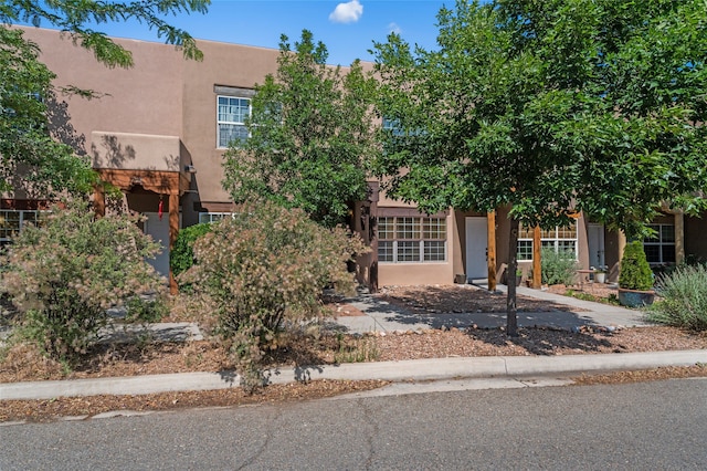 7206 Avenida El Nido, Santa Fe, NM 87507 - pueblo revival-style home with stucco siding