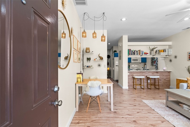7206 Avenida El Nido, Santa Fe, NM 87507 - foyer with light wood-style floors and recessed lighting