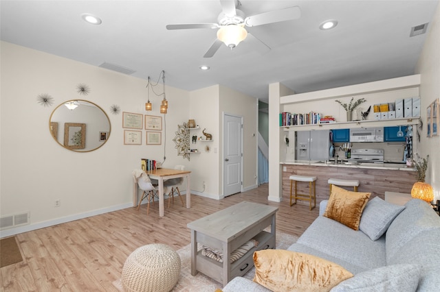 7206 Avenida El Nido, Santa Fe, NM 87507 - living area featuring light wood-style flooring, ceiling fan, and recessed lighting